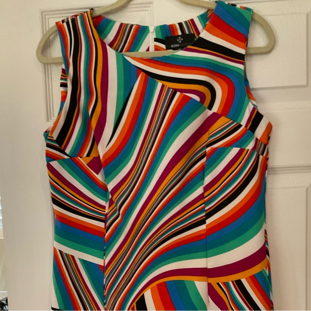 Multi colored dress and it’s sleeveless.